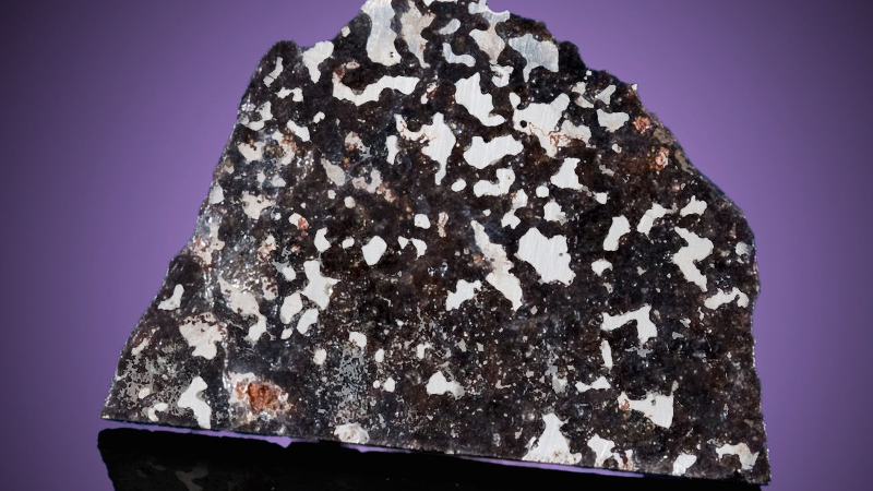 Illustration for article titled 30 Starry Wonders Hiding Inside of Dull Meteorites